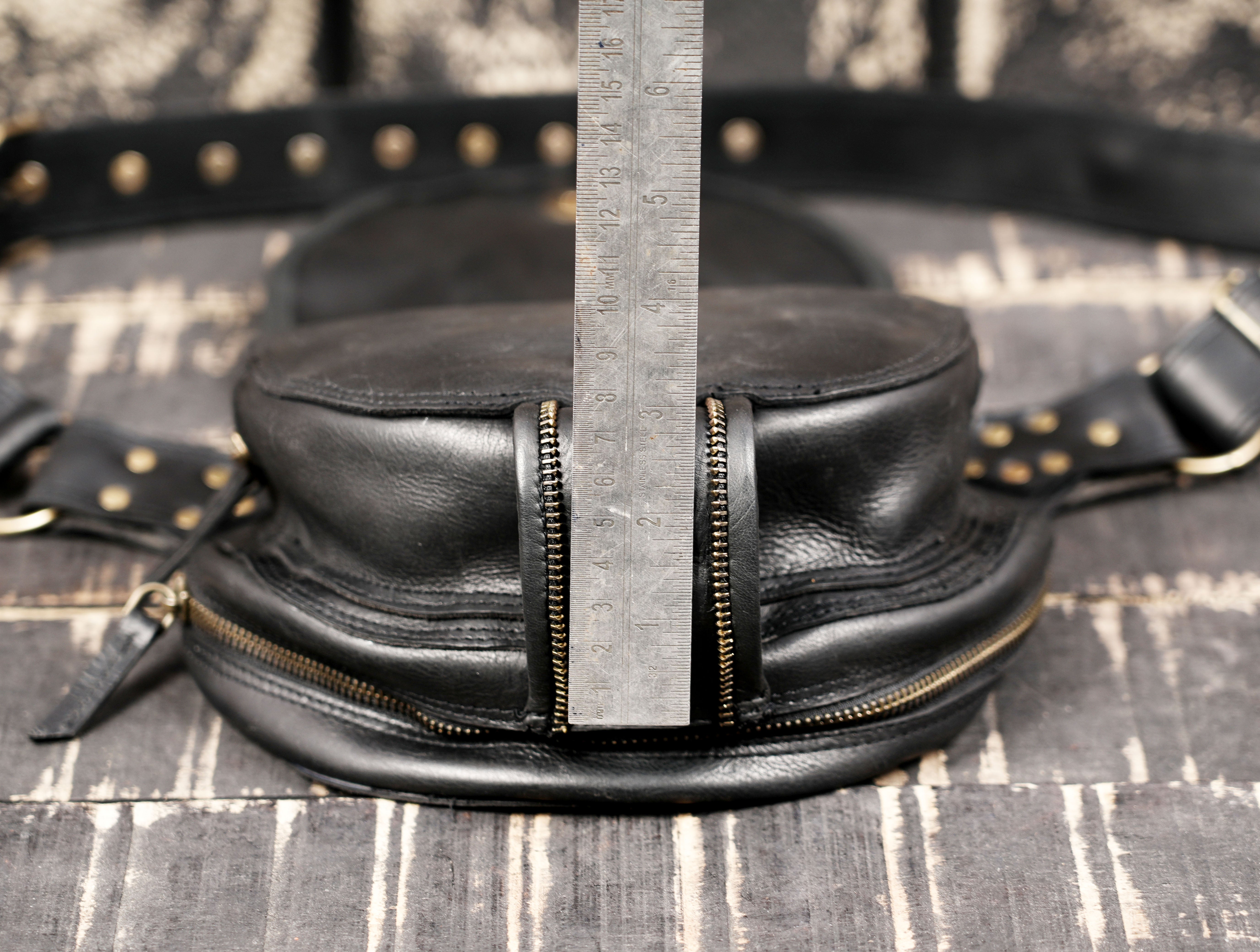 Black leather utility belt bag with handcrafted detailing