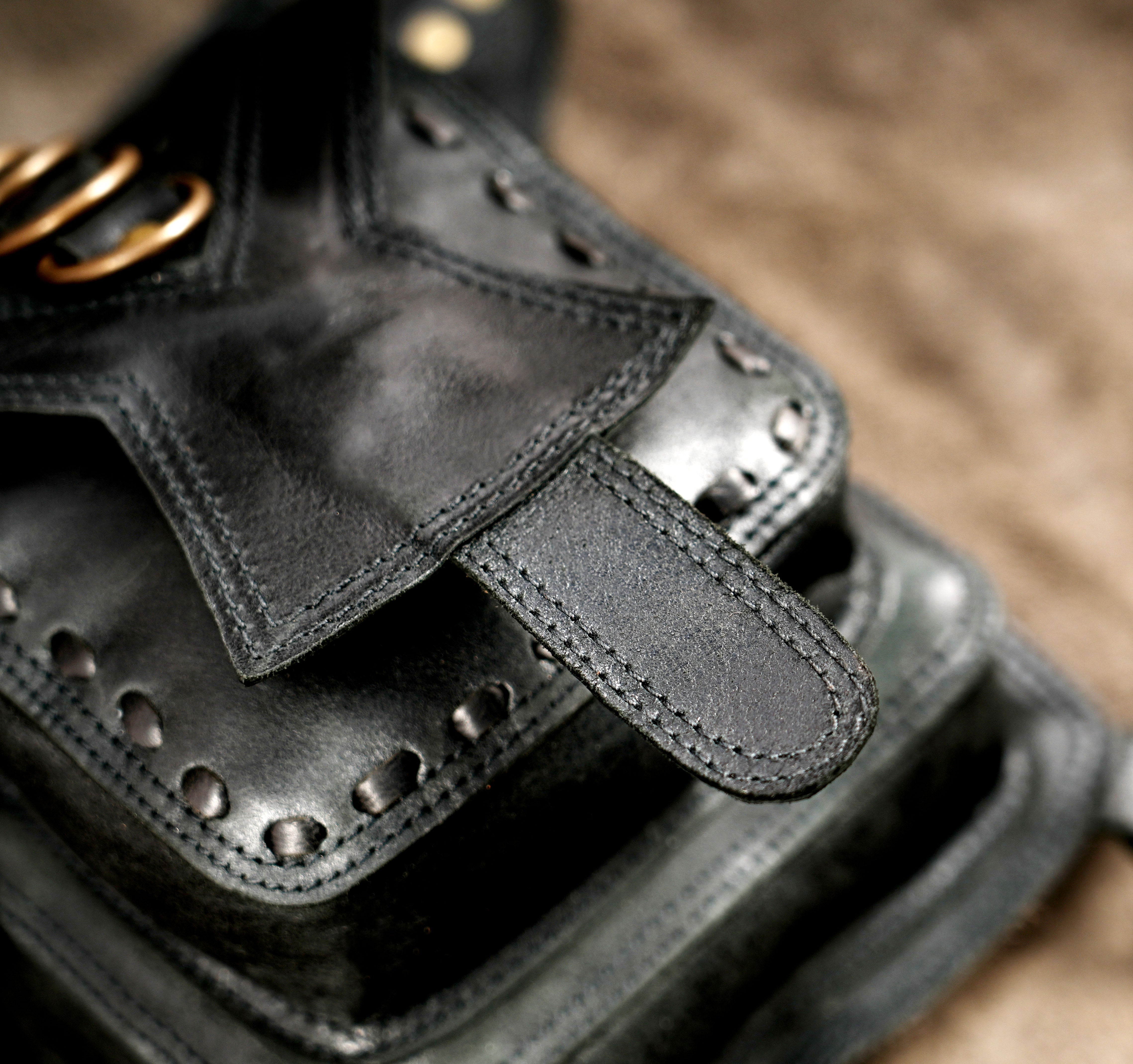 Black leather waist pouch with antique brass studs