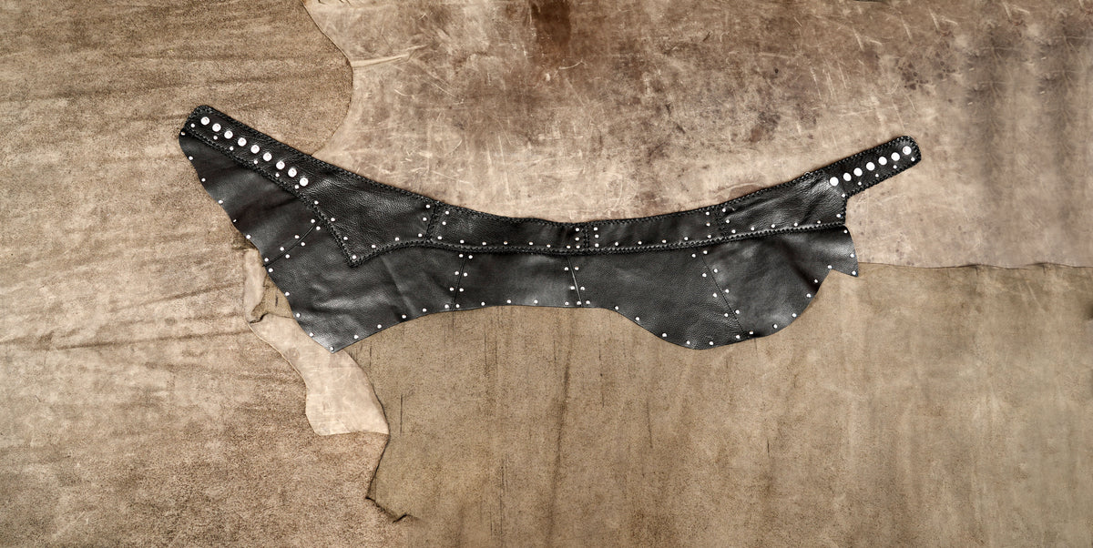 Black studded mini skirt for gothic festival outfits