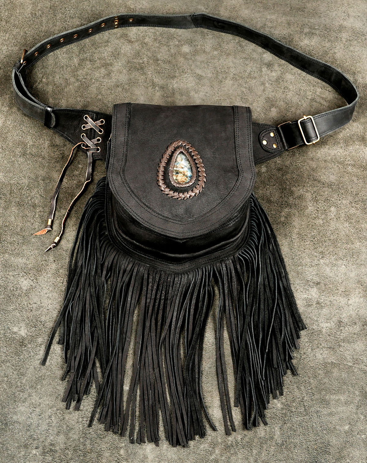 Black suede fringe belt bag with stone medallion