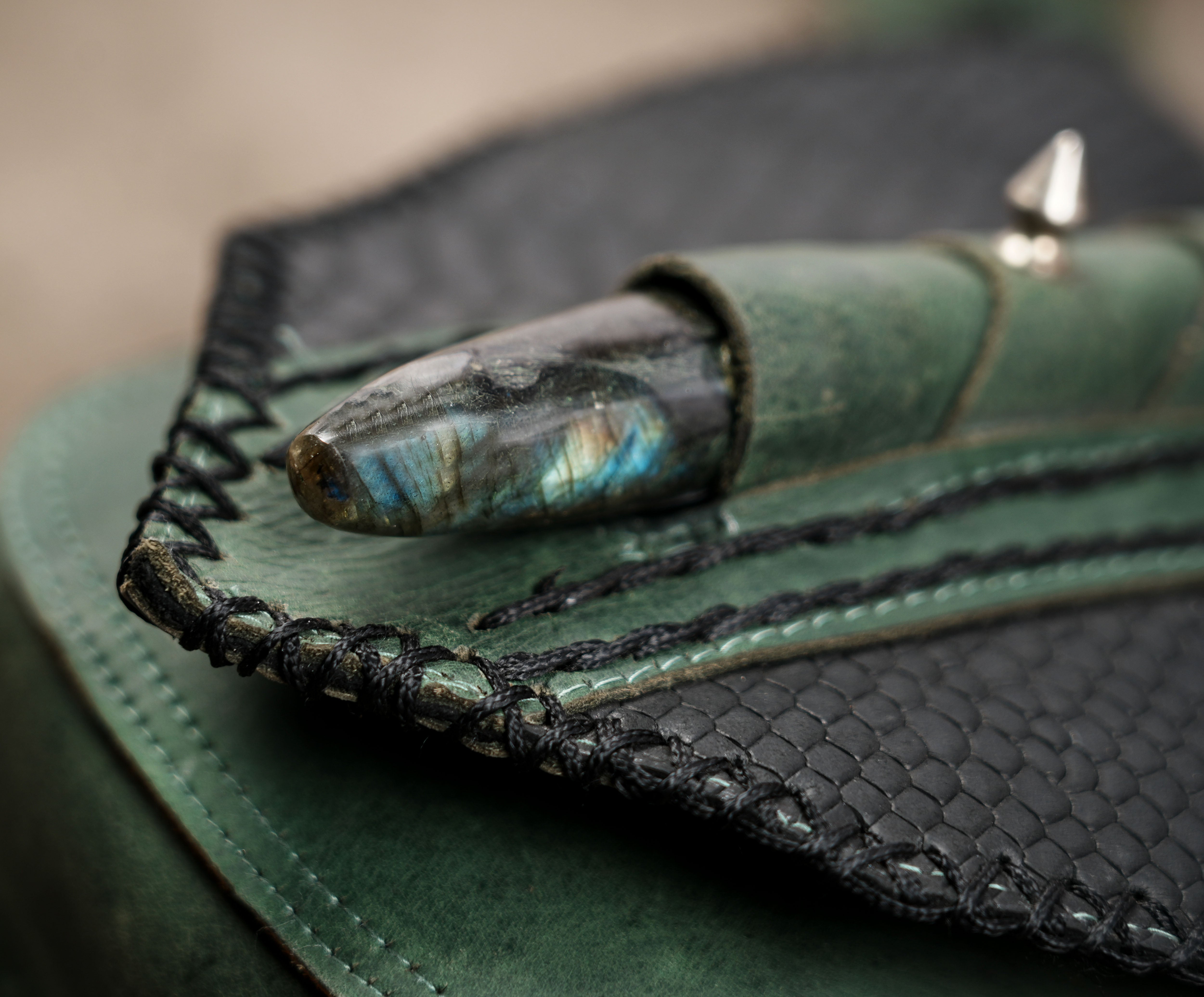Black textured leather hip pouch with crystal details