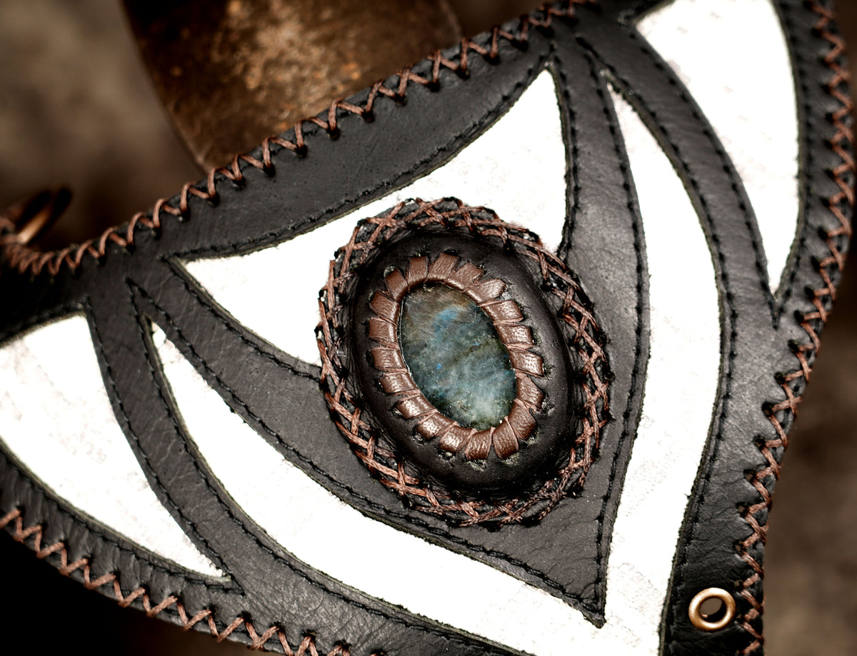 Edgy black utility holster with matching pouches and metal d-rings.