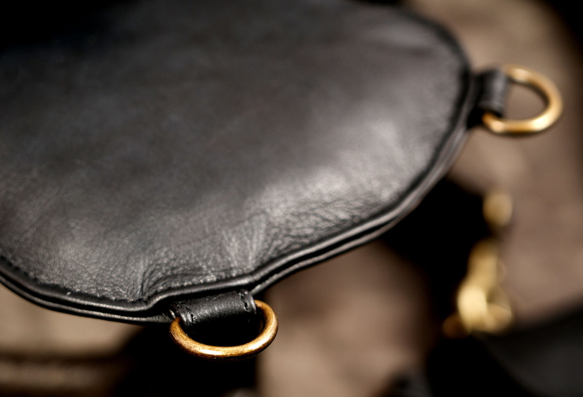 Black leather utility shoulder harness with adjustable pouch straps