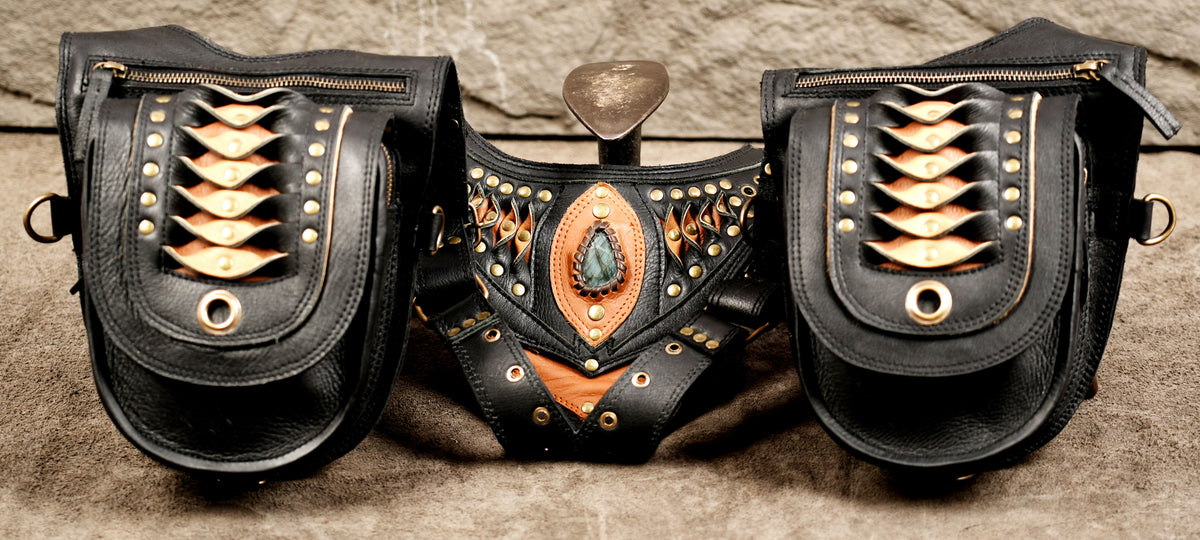 Handmade black leather double holster shoulder bag for Burning Man and music festivals.
