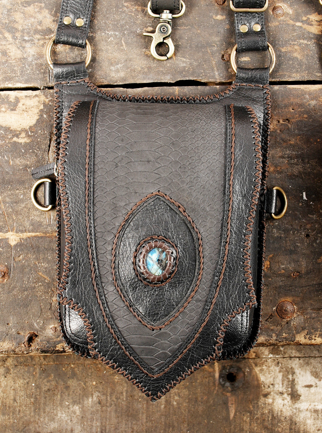 Dark aesthetic leather shoulder harness featuring matching dual holsters   