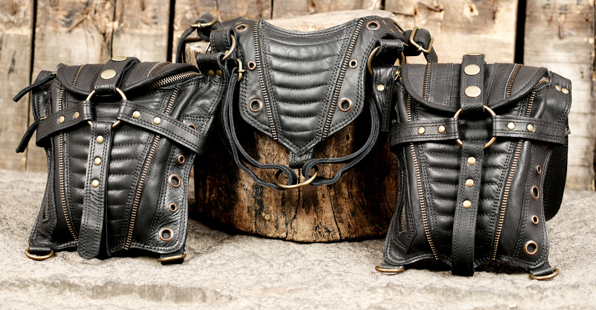 Unisex black leather utility harness with two structured waist pouches and adjustable straps