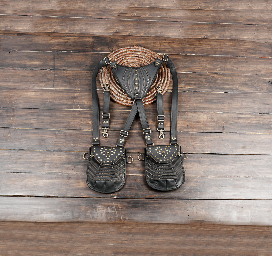 Black leather double hip pouch harness bag with decorative brass studs and adjustable straps
 