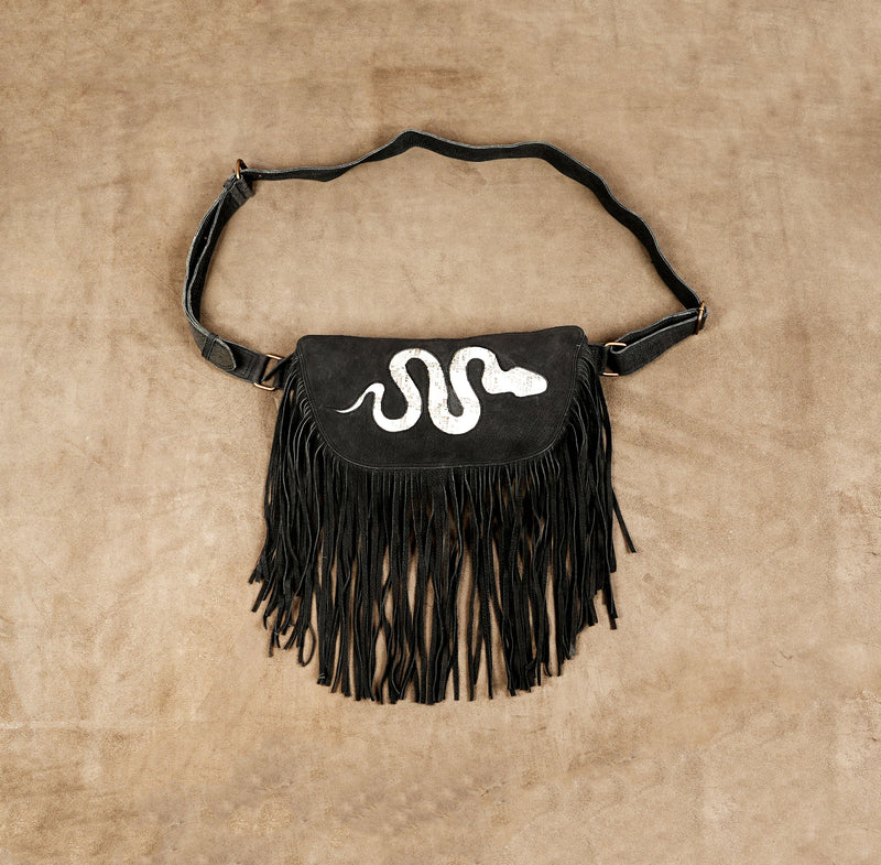 Black leather fringe waist bag with white snake design and adjustable belt for women.