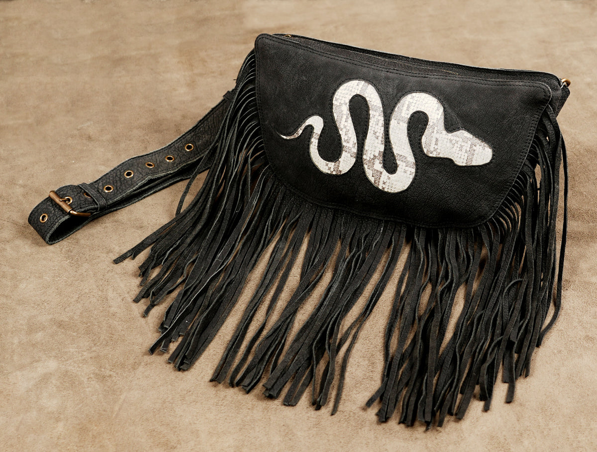 Black steampunk waist bag with dangling fringe and snake design for festival outfits.