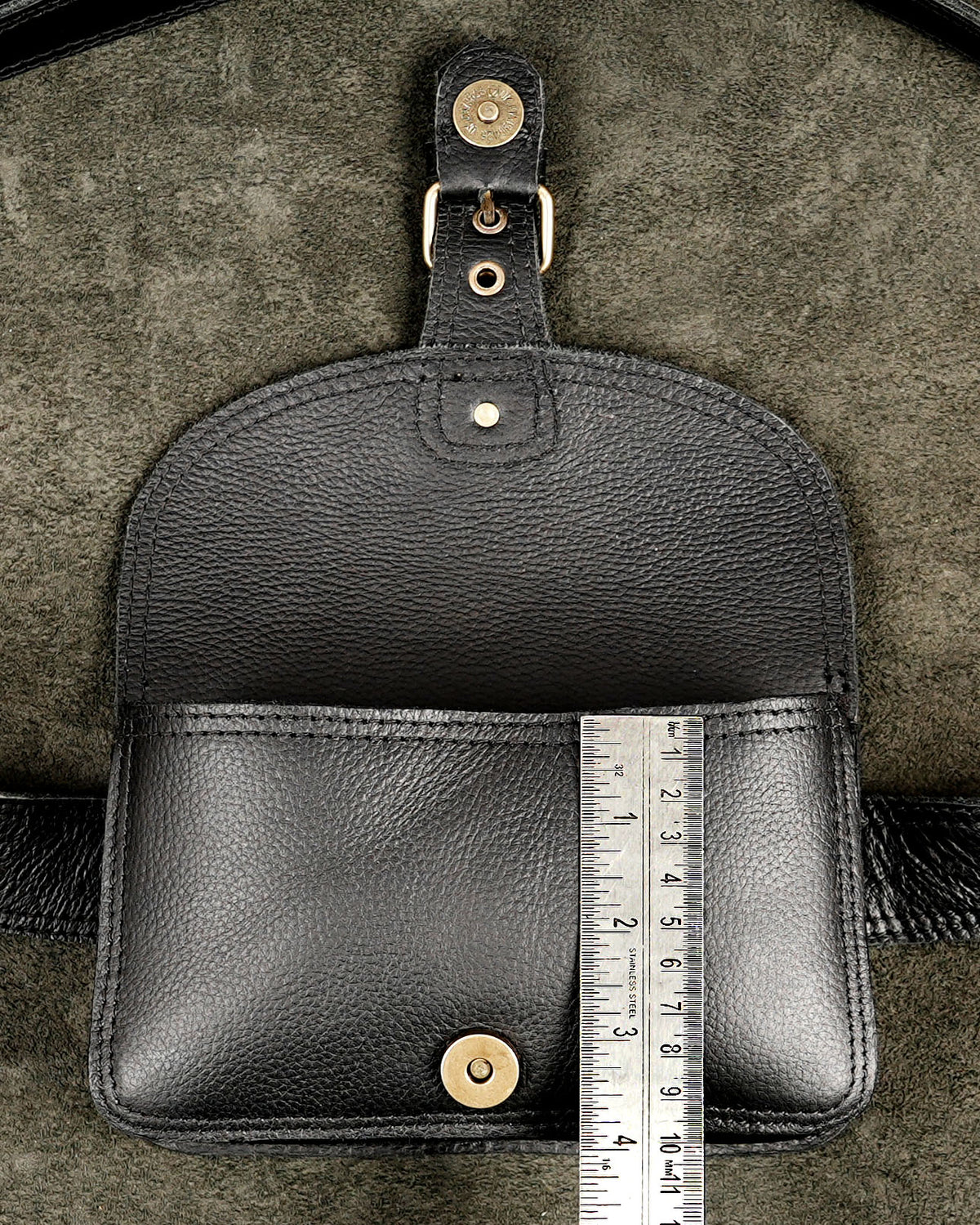 Classic black leather fanny pack with adjustable buckled belt strap