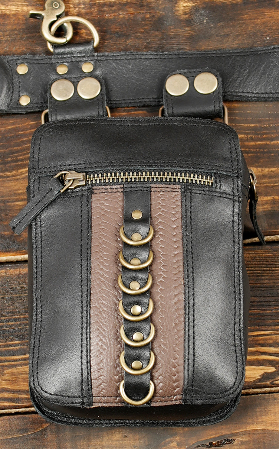 Handcrafted black leather harness with integrated waist belt and zipped pockets   