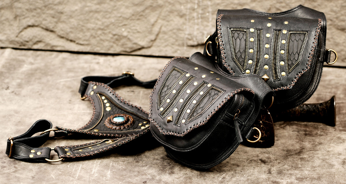 Black leather thigh holster bags with adjustable harness straps for festivals

