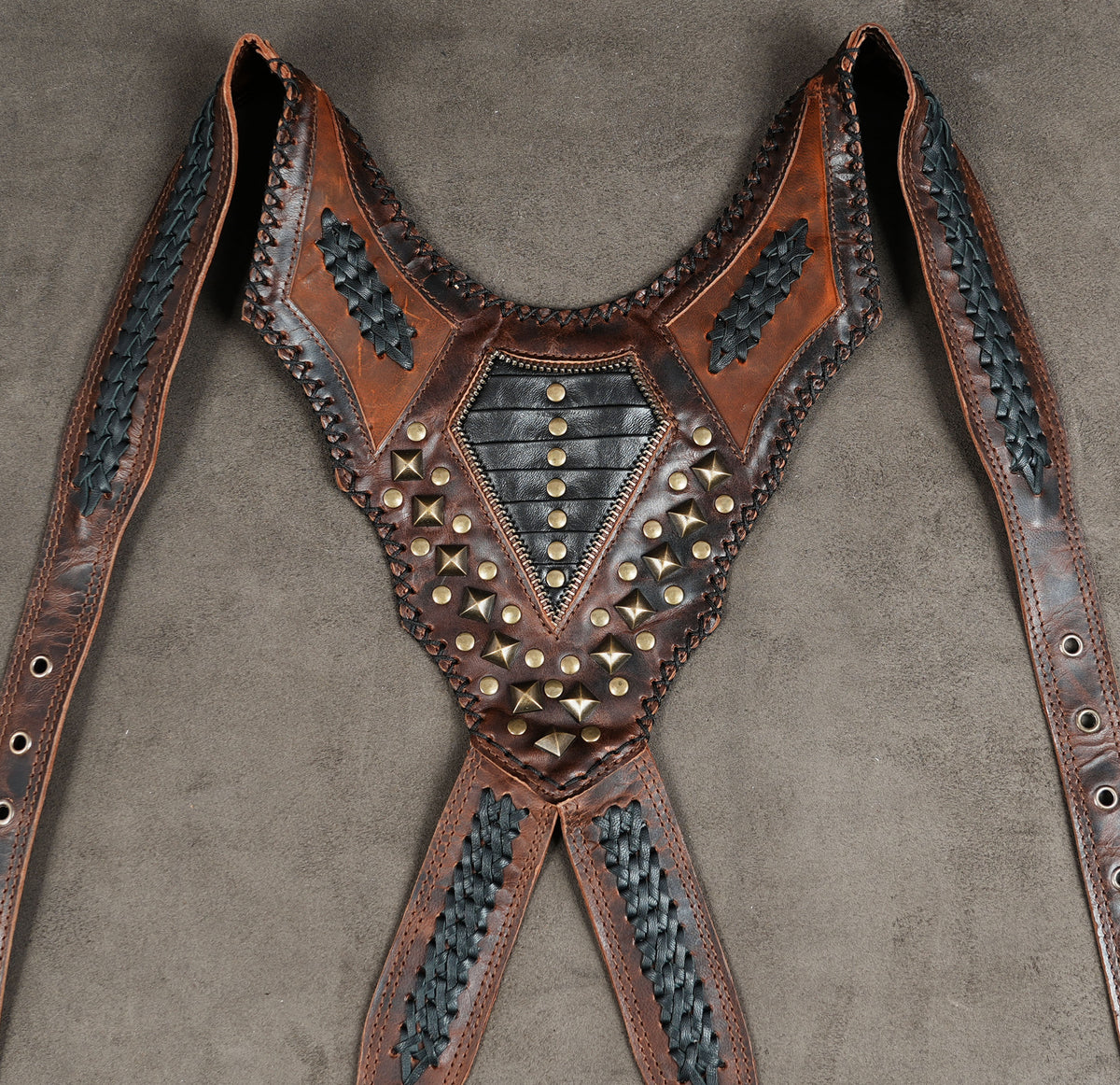 Brown leather utility harness with two storage pouches and metal stud detailing