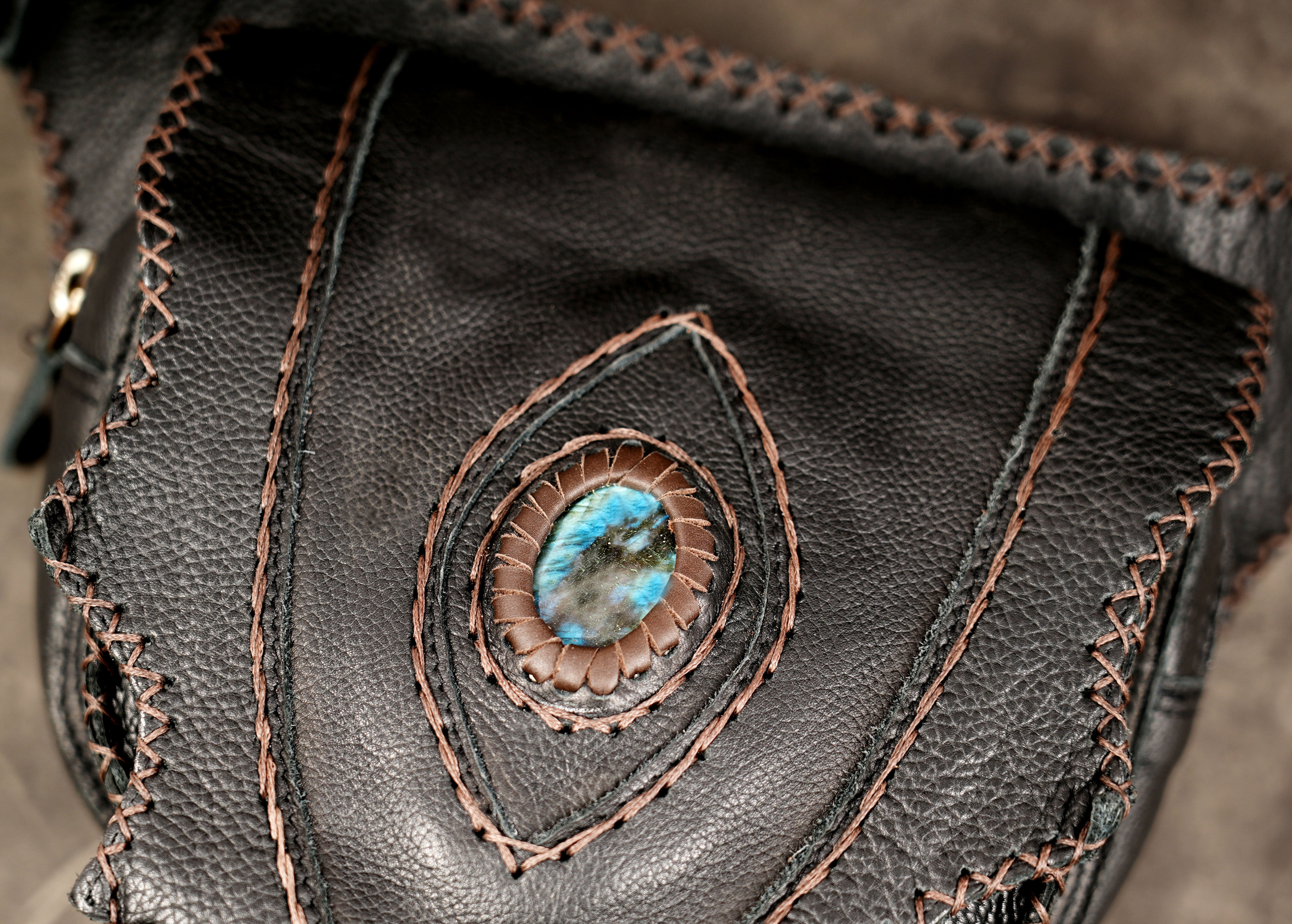 Boho black leather hip pouch with decorative stitching