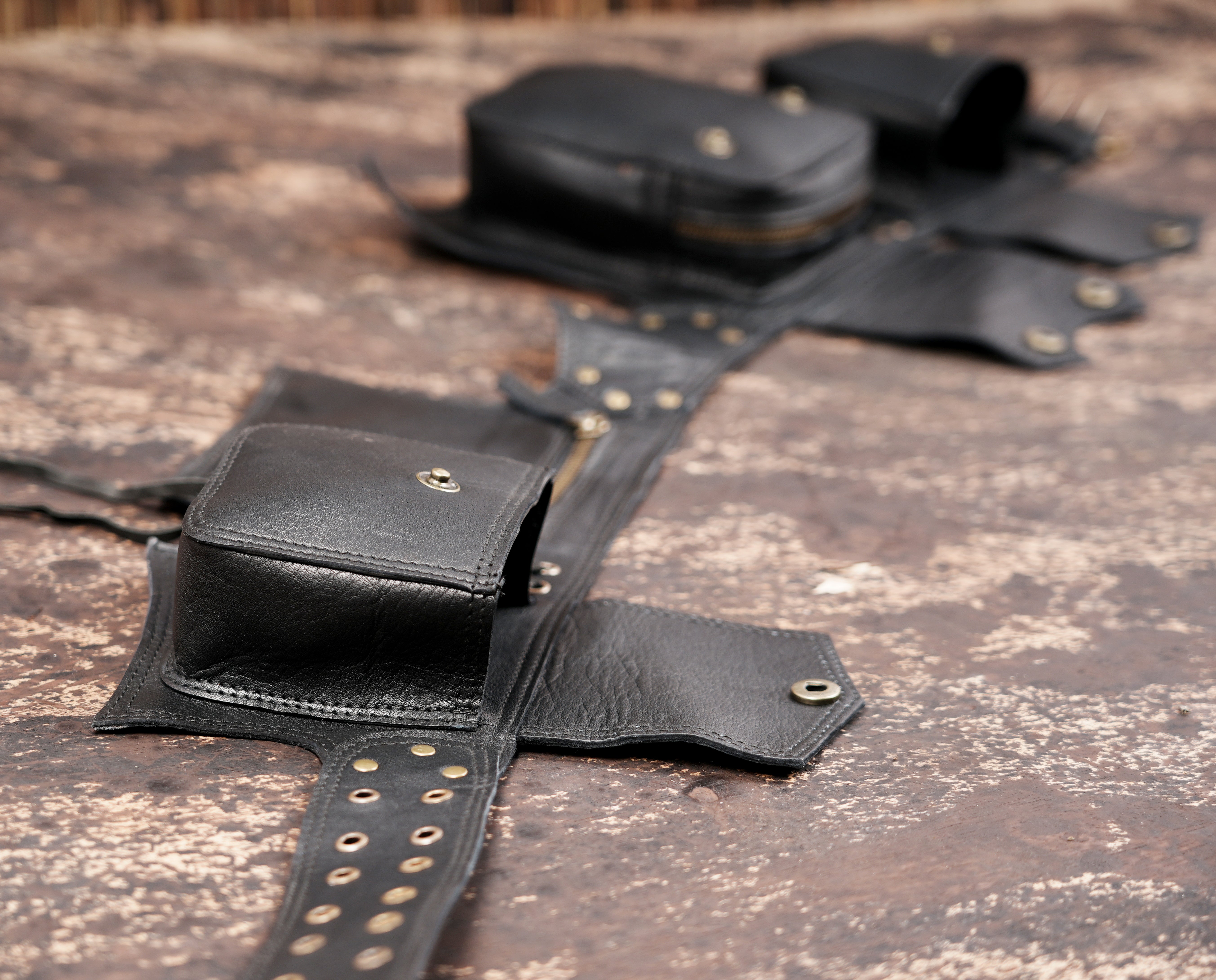 Boho leather belt bag with lace up center and snap pockets