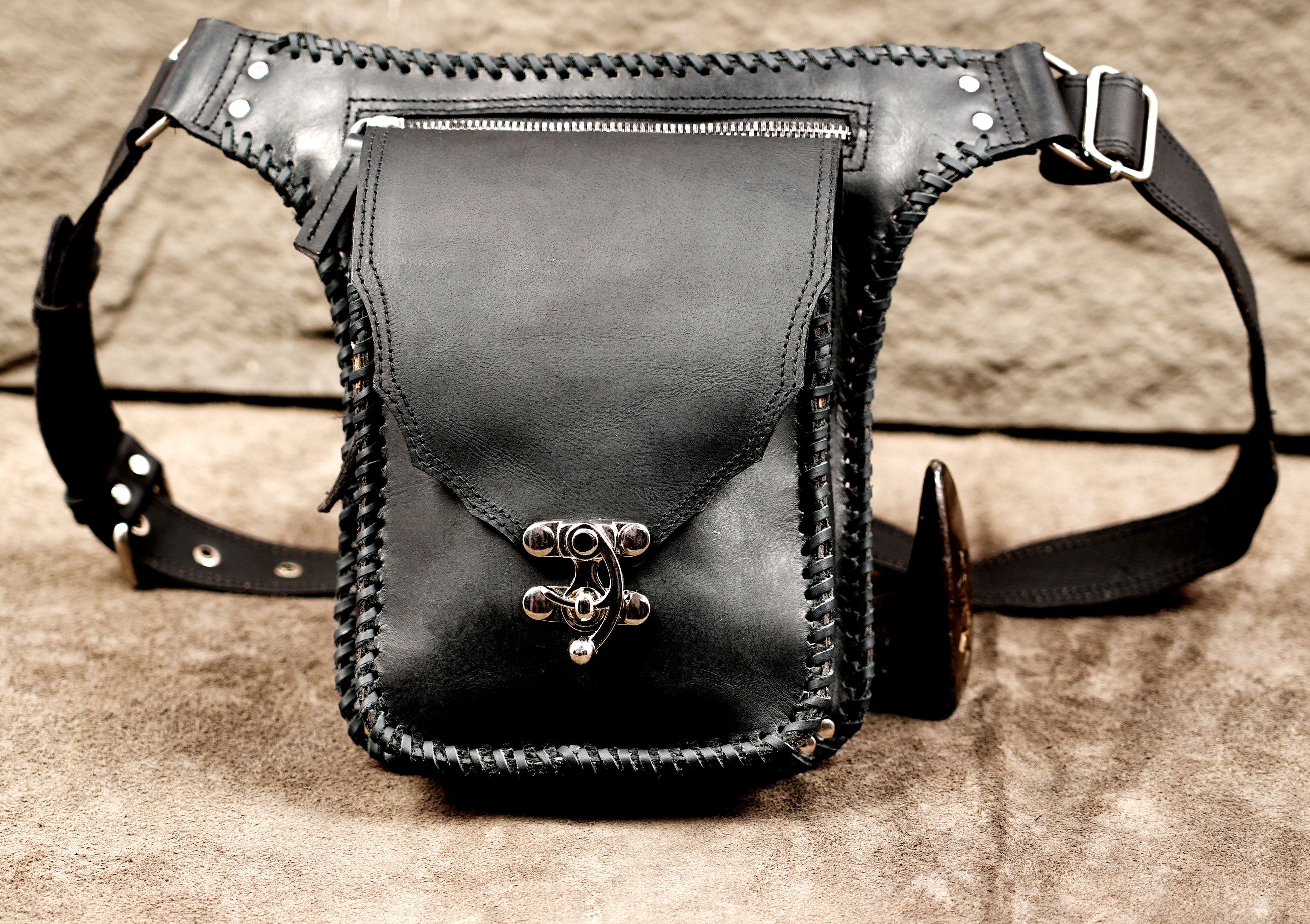 Boho leather belt bag with whipstitch trim, close up view