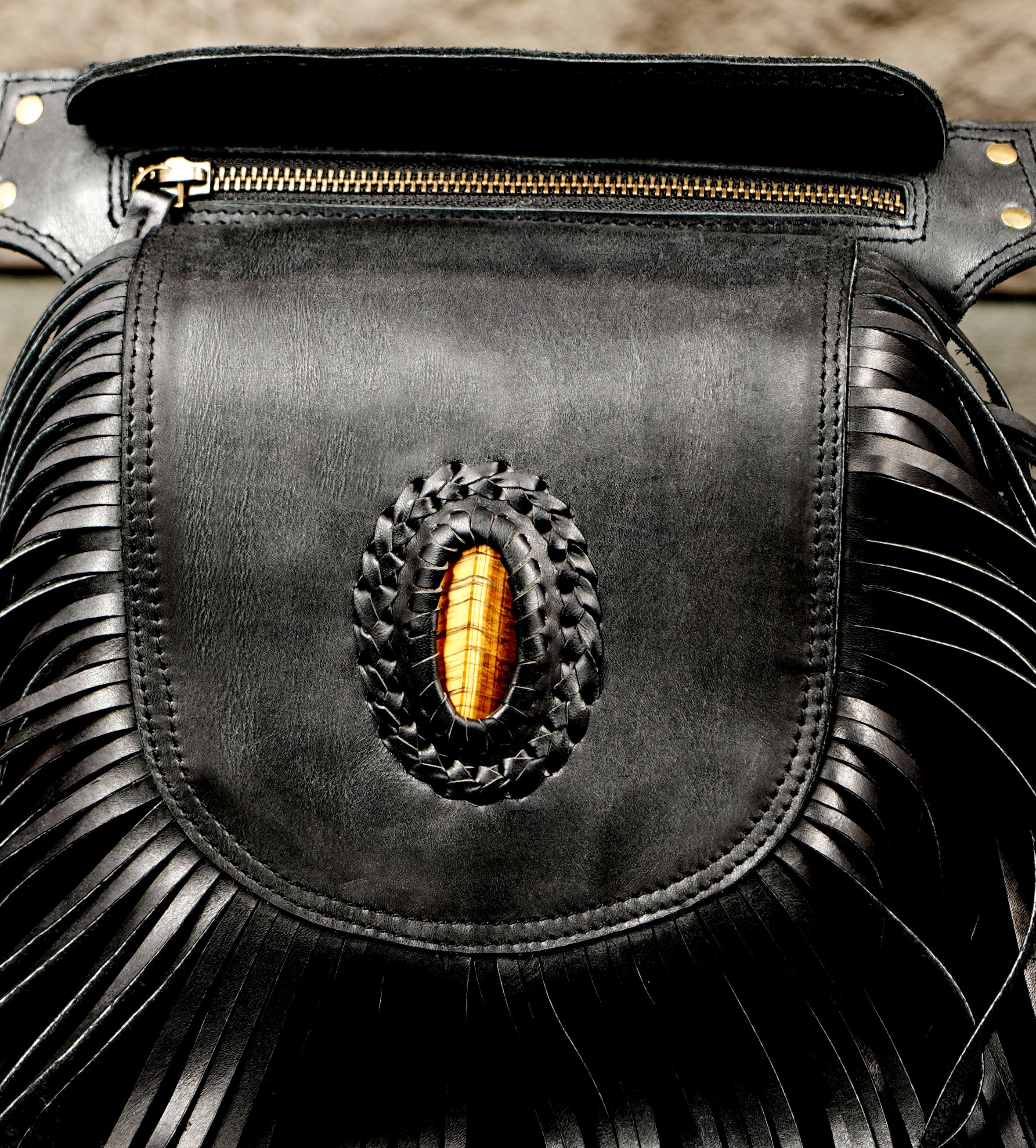 Boho leather fanny pack with braided stone and full fringe
