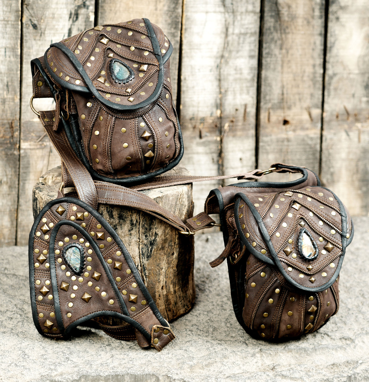 Brown leather festival harness with two matching utility bags and natural stone accents