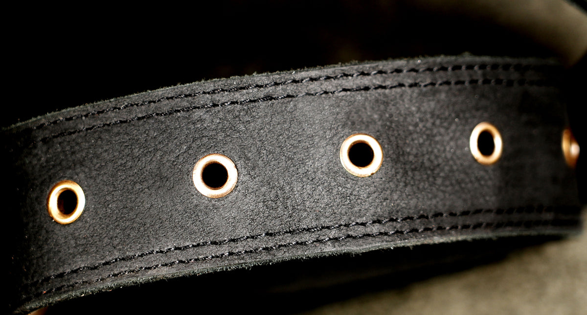 Black leather convertible waist bag with detachable strap and swivel hooks