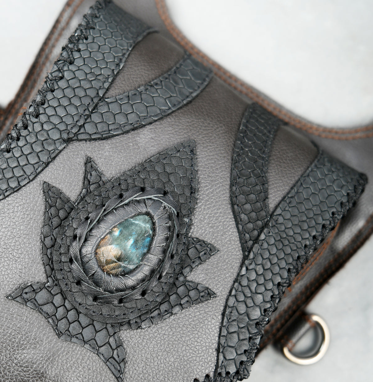 Unisex festival leather harness bag with two front pockets and adjustable buckle straps.