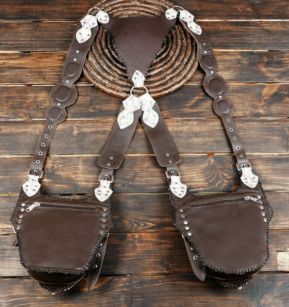 Brown and white leather shoulder bag with an Om chest panel