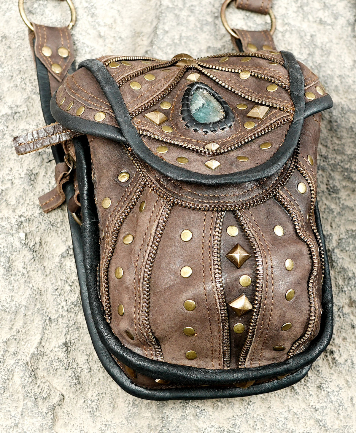Handmade brown leather double pouch harness with decorative studs and adjustable shoulder straps