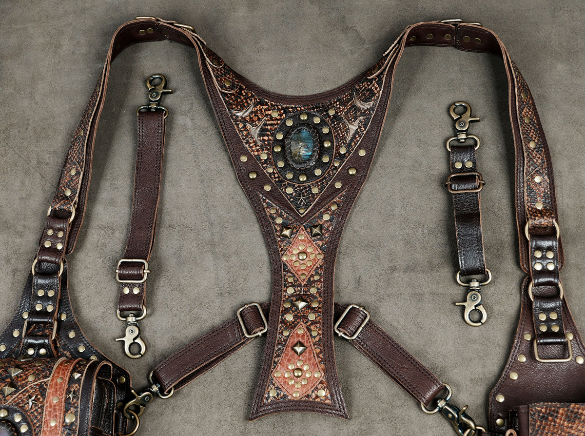 Gothic leather shoulder holster bag with textured leather panels and metallic stud accents.