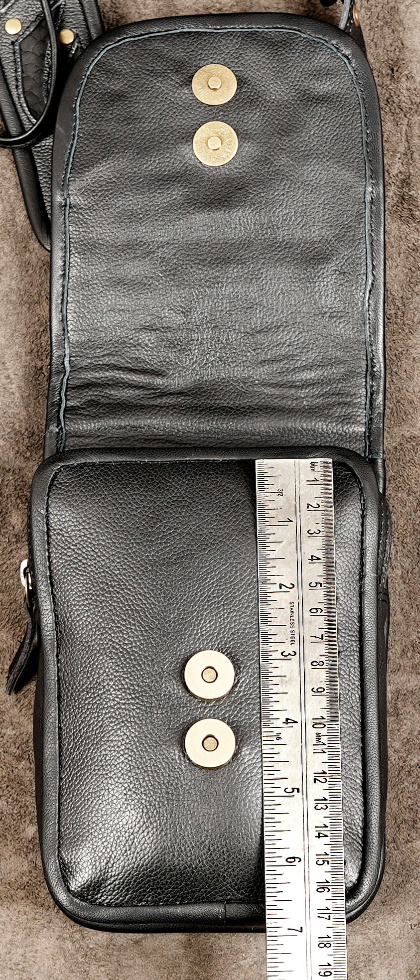 Black leather rave harness bag with gold tone hardware and studded pockets