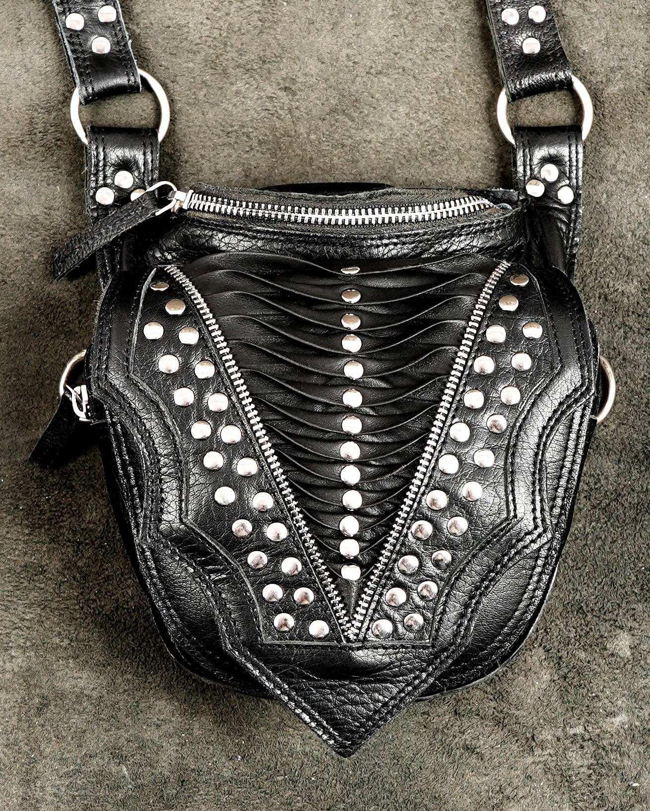Chest holster bag with silver studs, flat lay front view