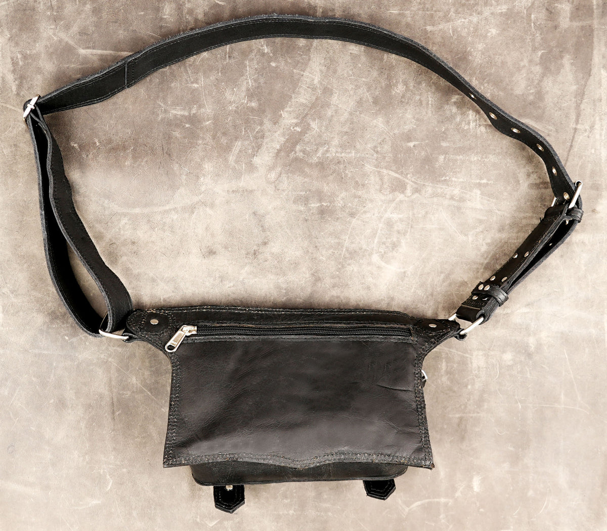 Classic messenger style leather bag with buckle straps