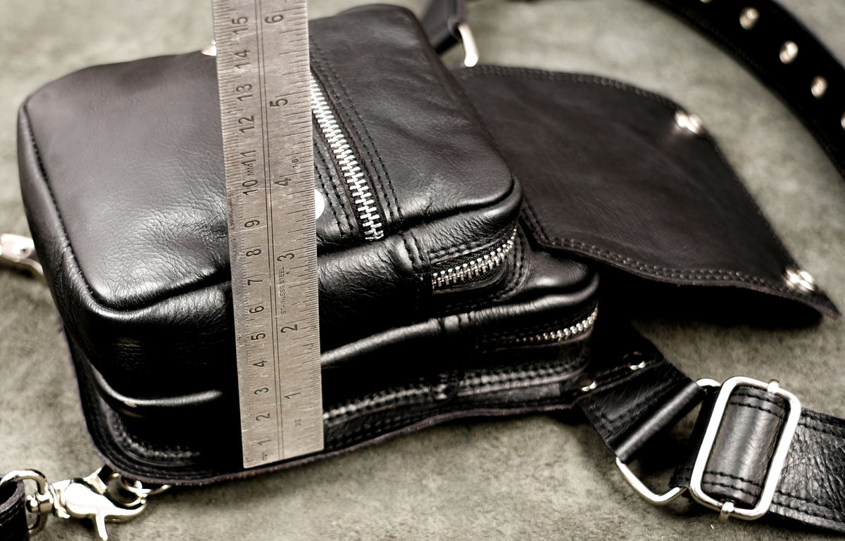 Clean leather hip bag with zip and snap pockets