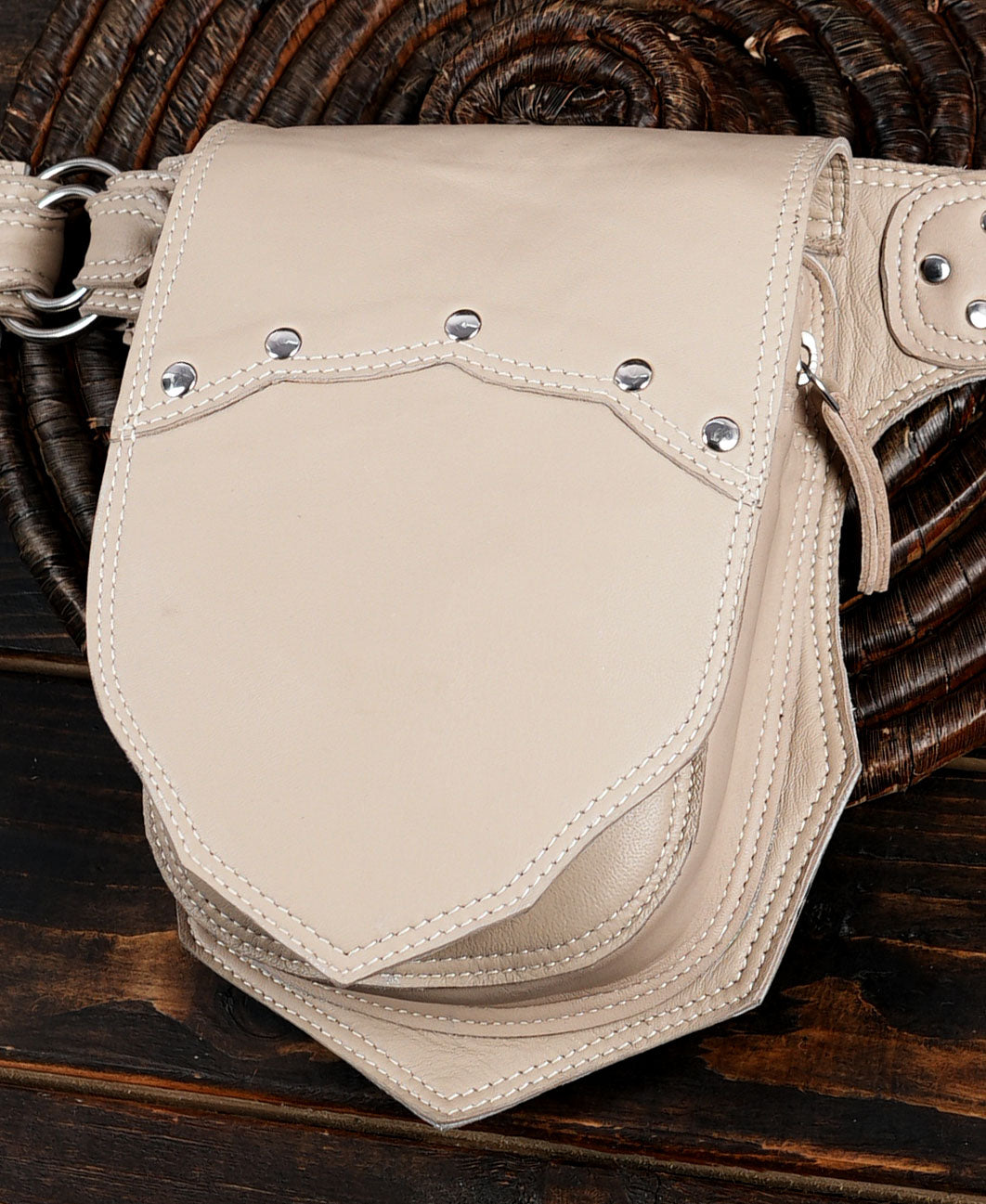 Cream toned leather waist belt, symmetrical front view