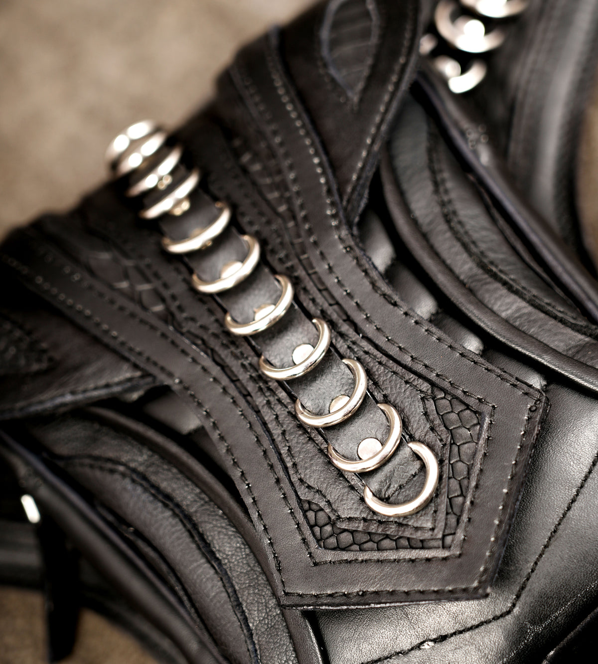 Cyberpunk leather hip bag, symmetrical front detail view