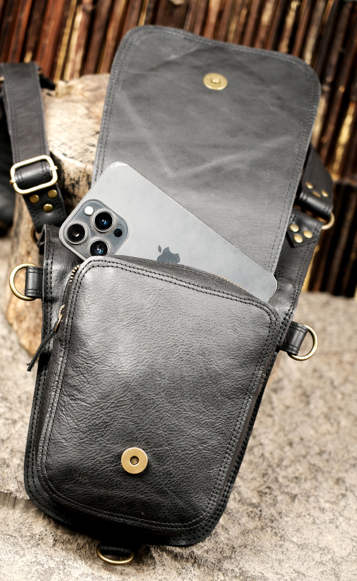 Black leather utility harness bag with adjustable chest straps