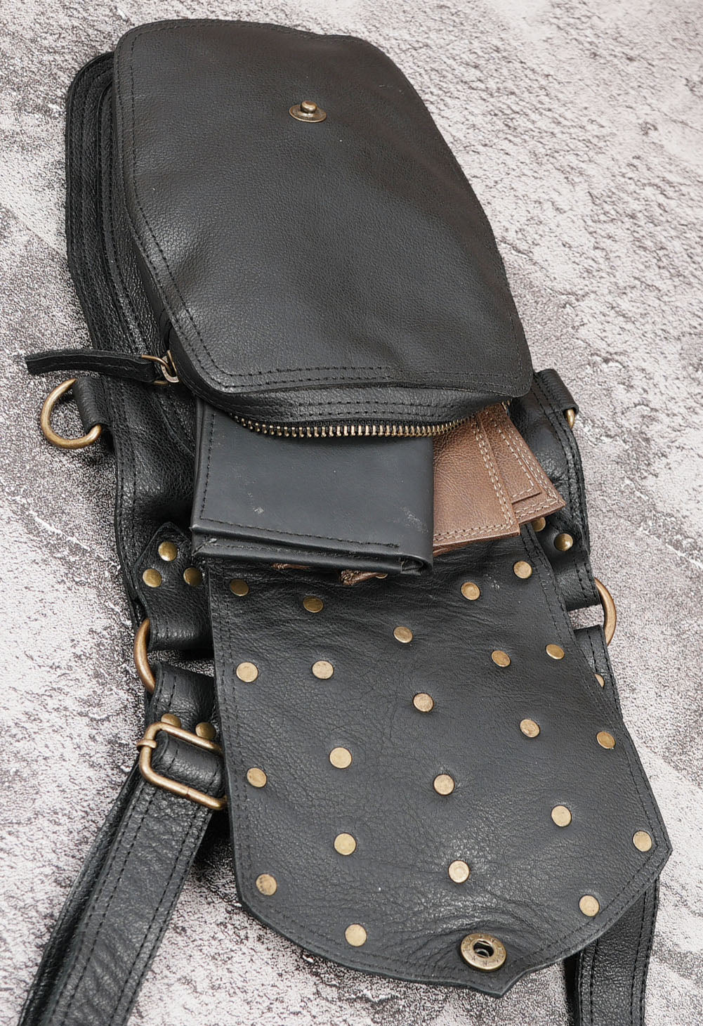 Black leather tactical style crossbody bag with adjustable harness straps