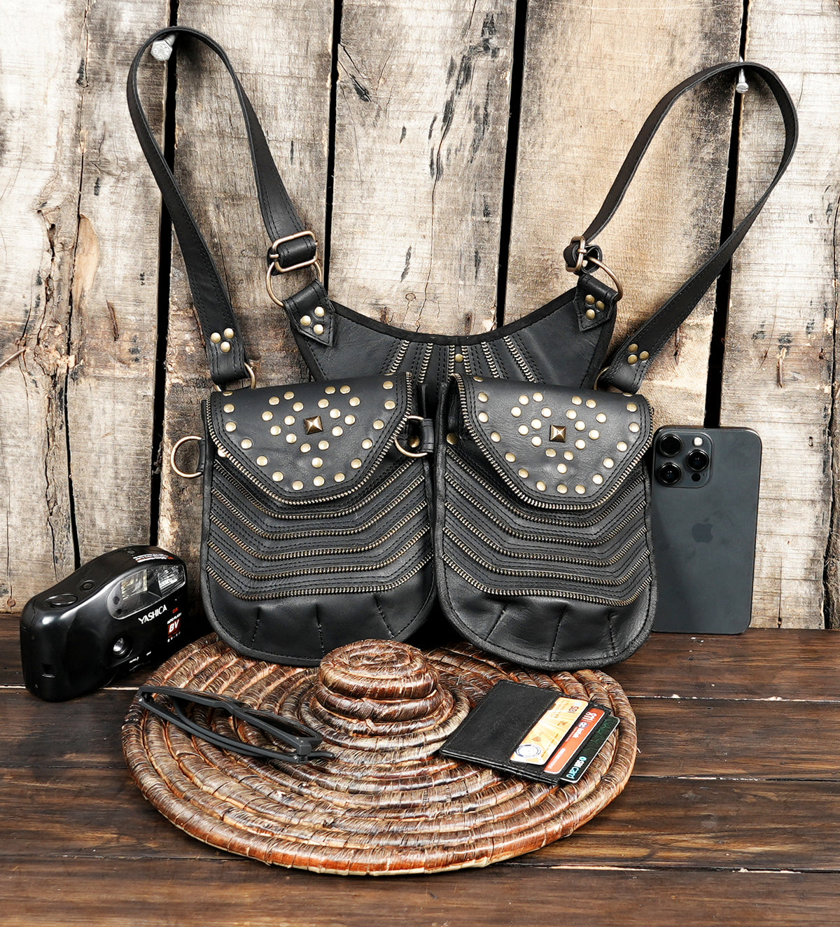 Genuine black leather double hip bag with layered zipper details and metal accents
