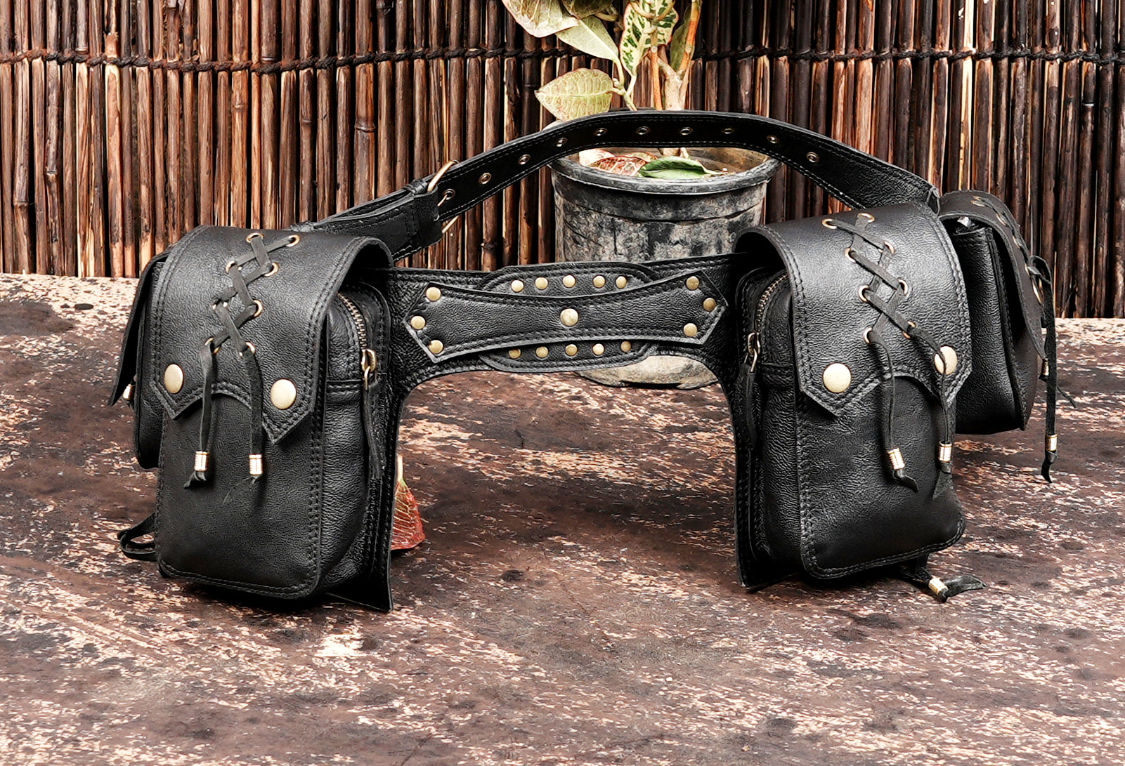 Adjustable leather hip belt with lace accents and rivets