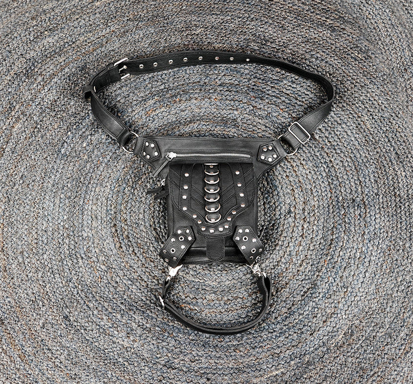 Black leather waist and thigh belt with metal studs and rings