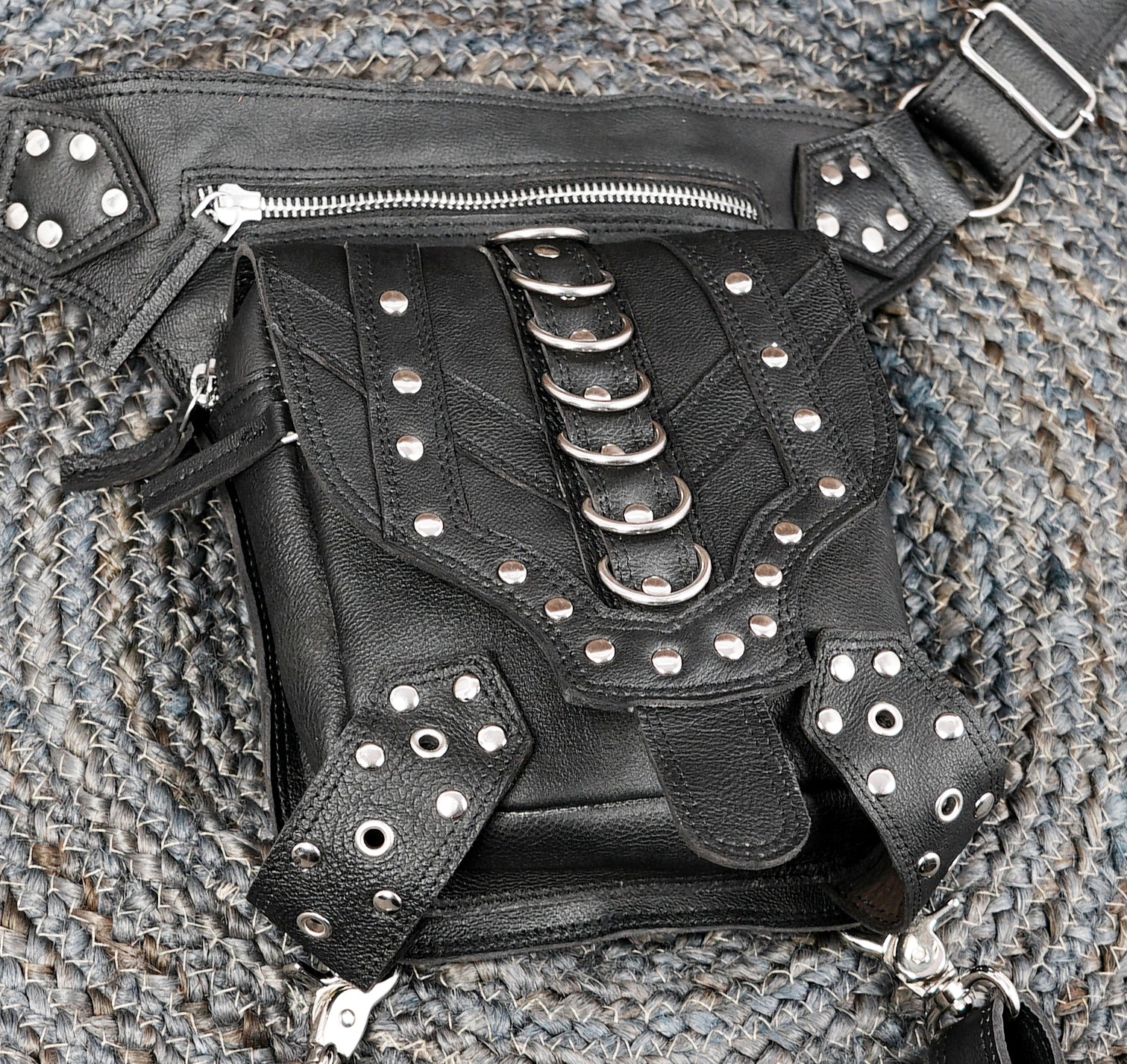 Adjustable leather hip and thigh holster belt with rivet details