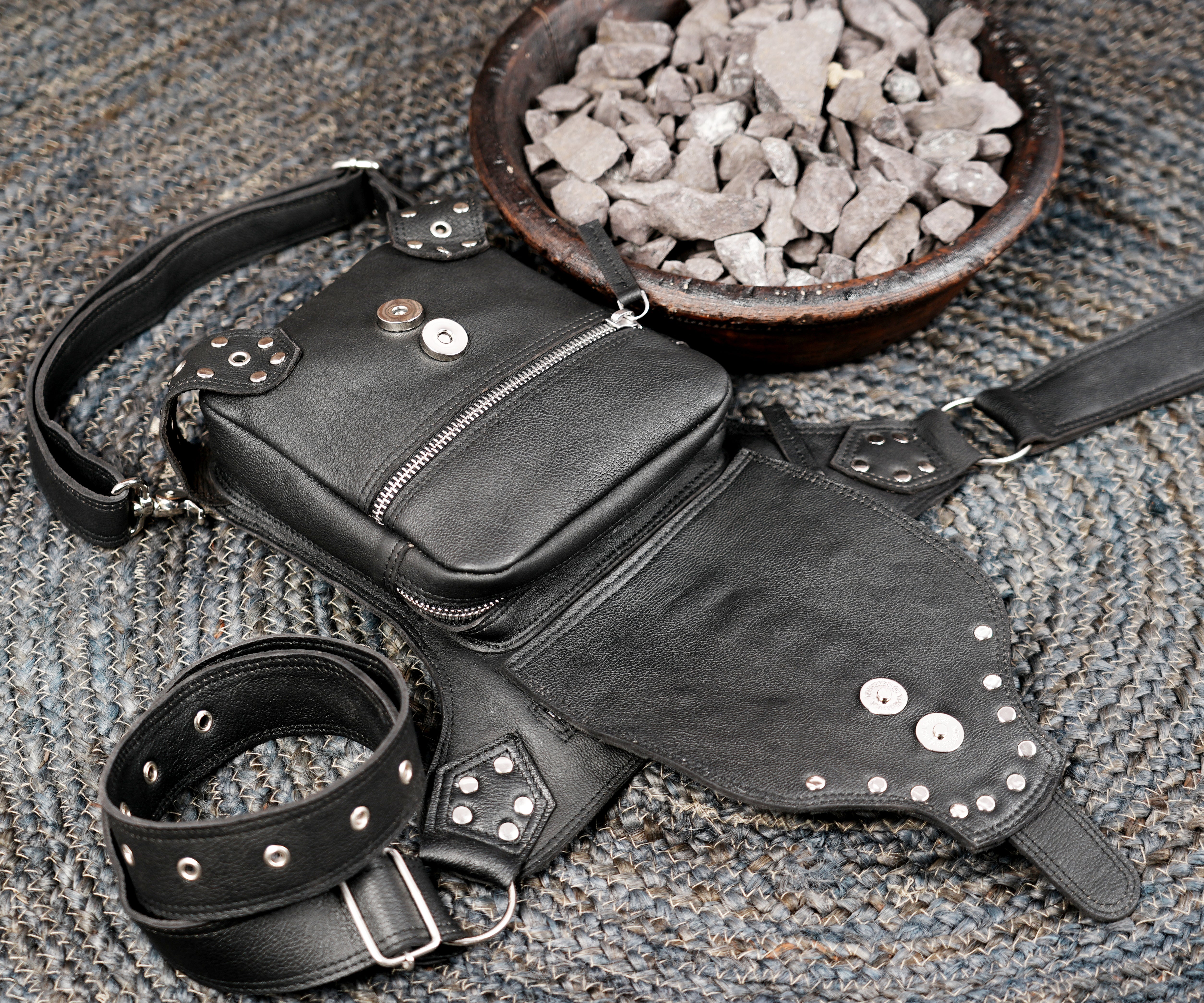 Riveted leather waist and leg belt with secure buckle fastening