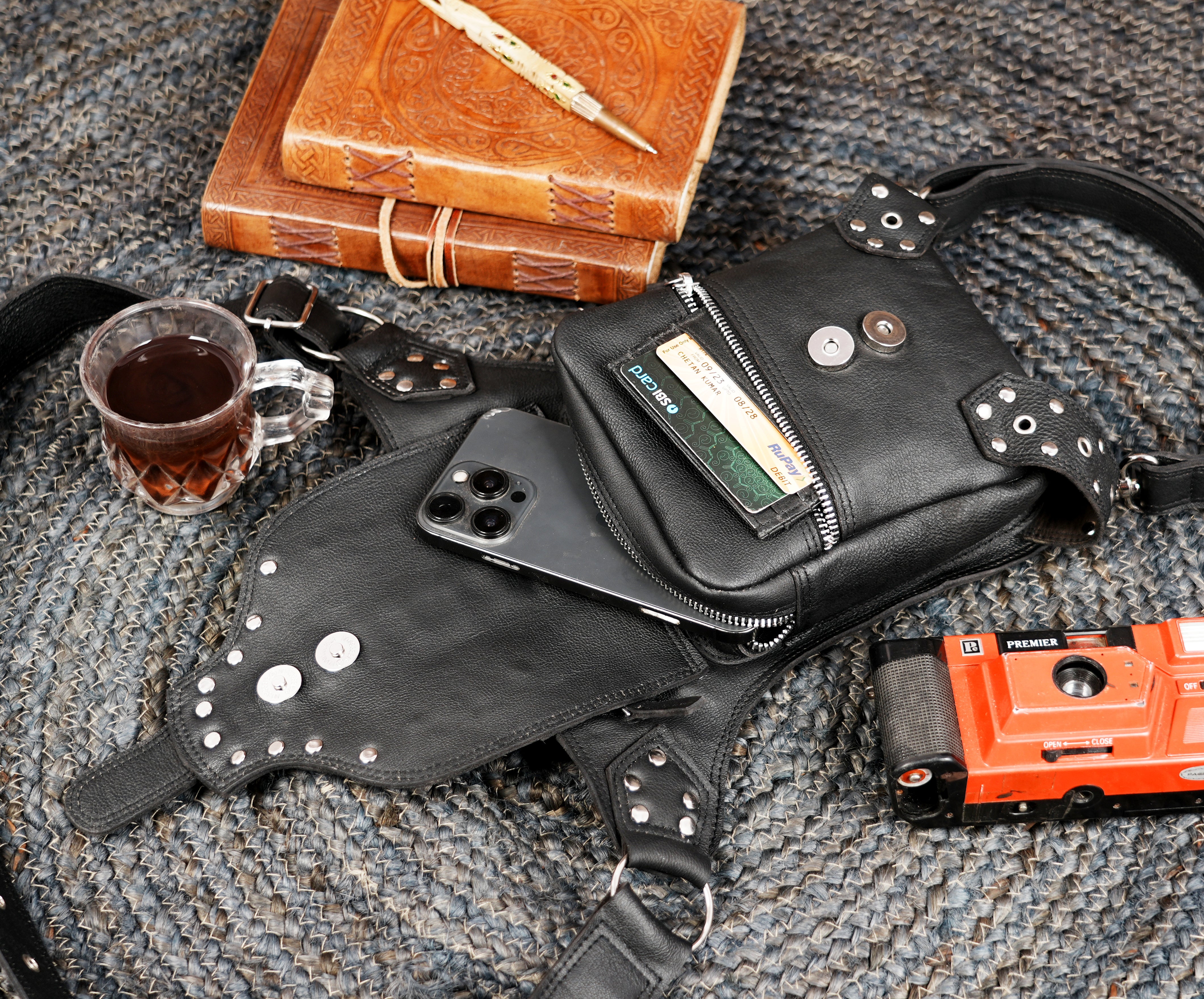 Leather traveling belt with thigh support strap and front pocket