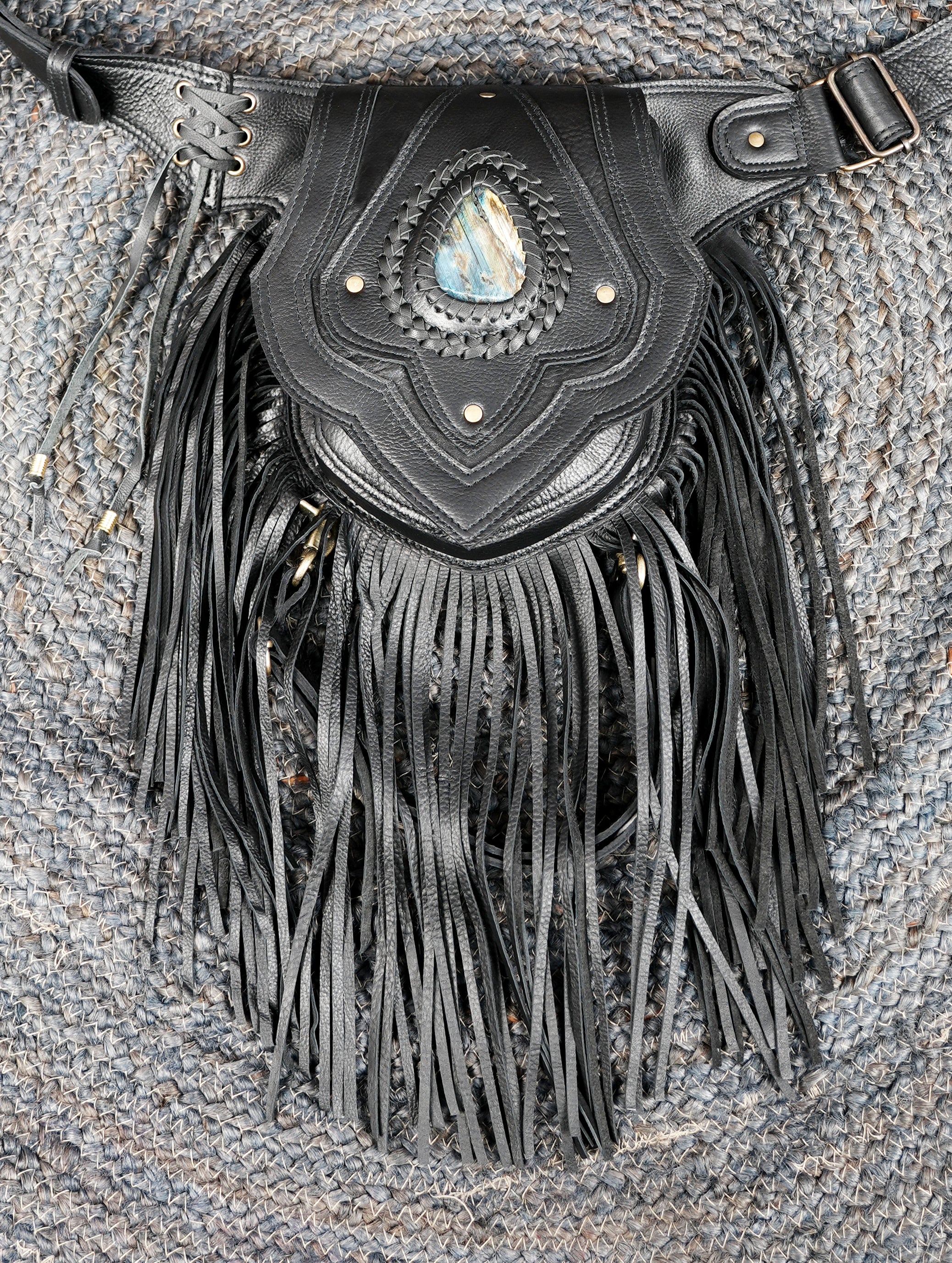 Black leather utility belt with long fringe and artisan stitching