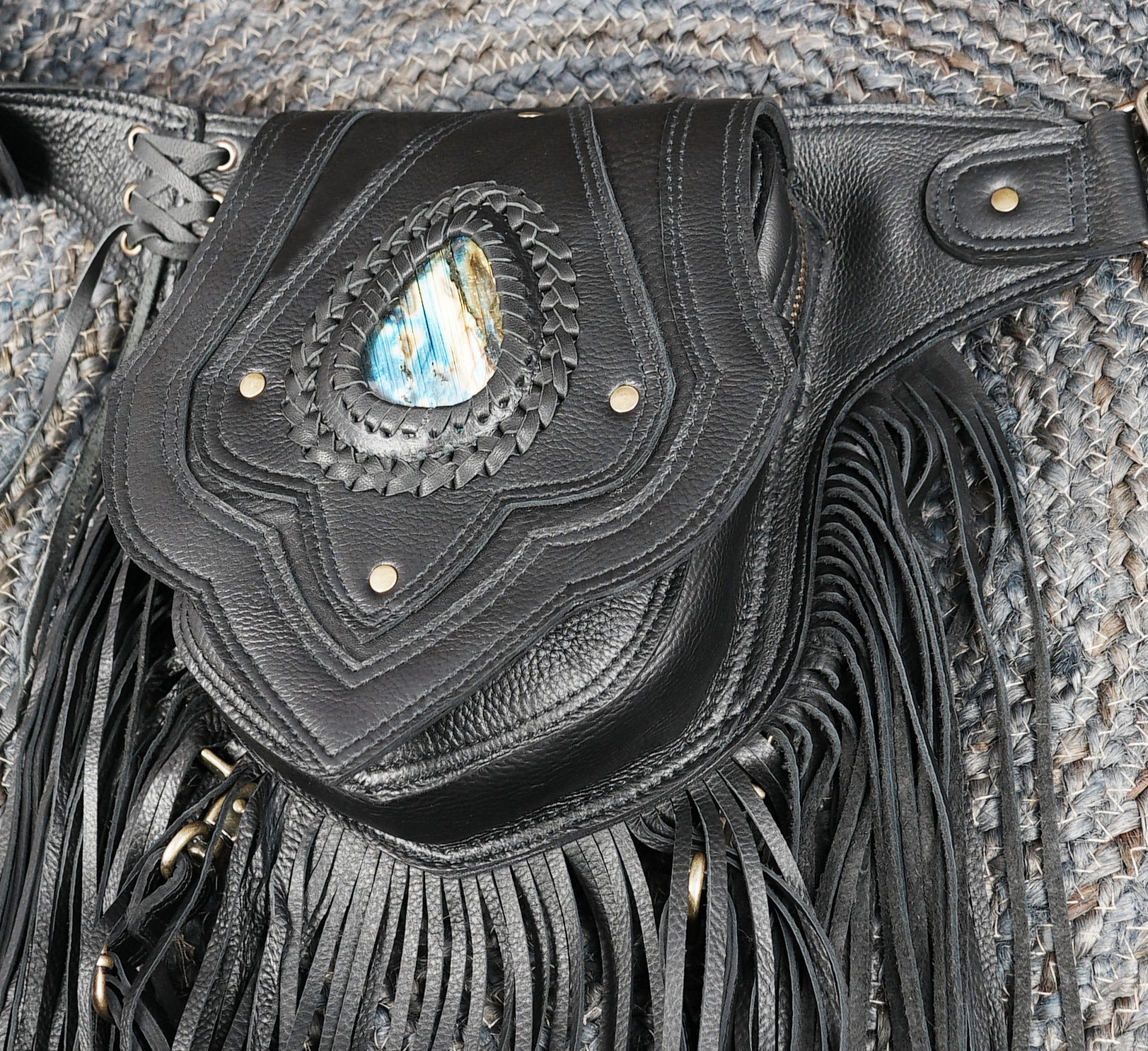 Adjustable black leather belt with fringe and handcrafted design