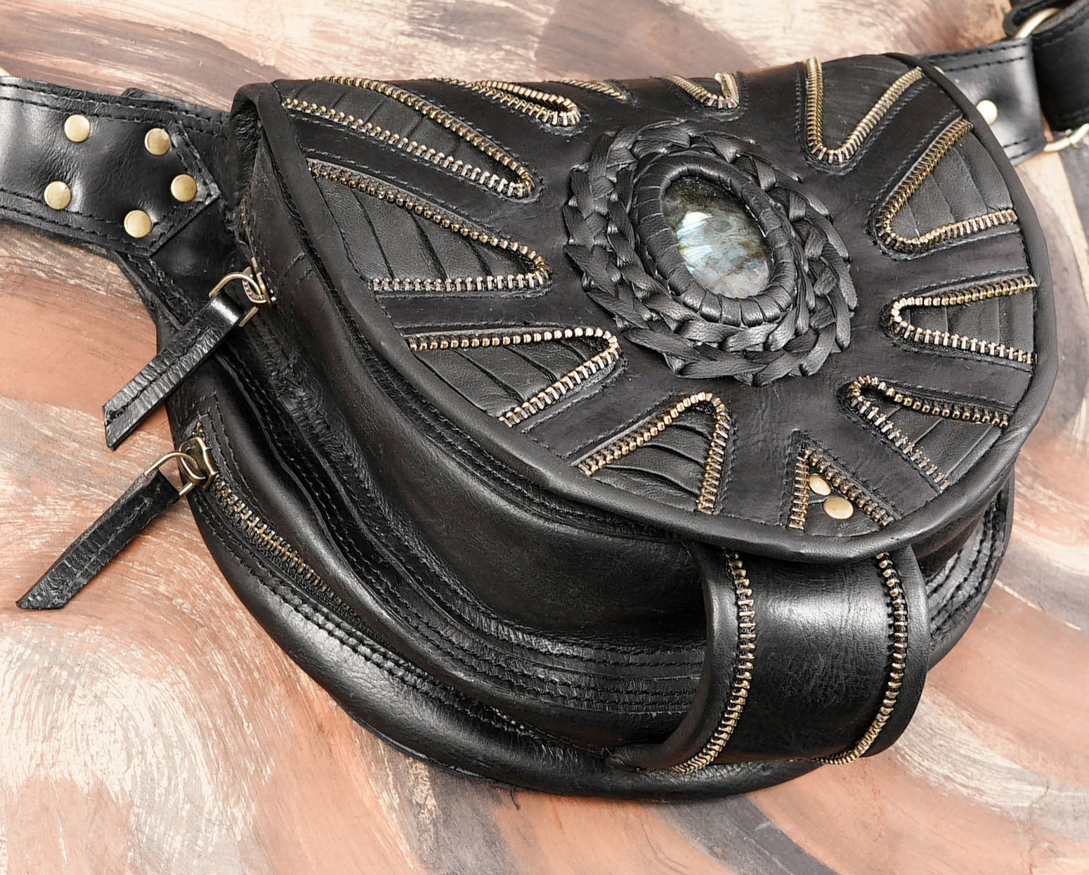 Black leather waist bag with antique brass studs and zippers