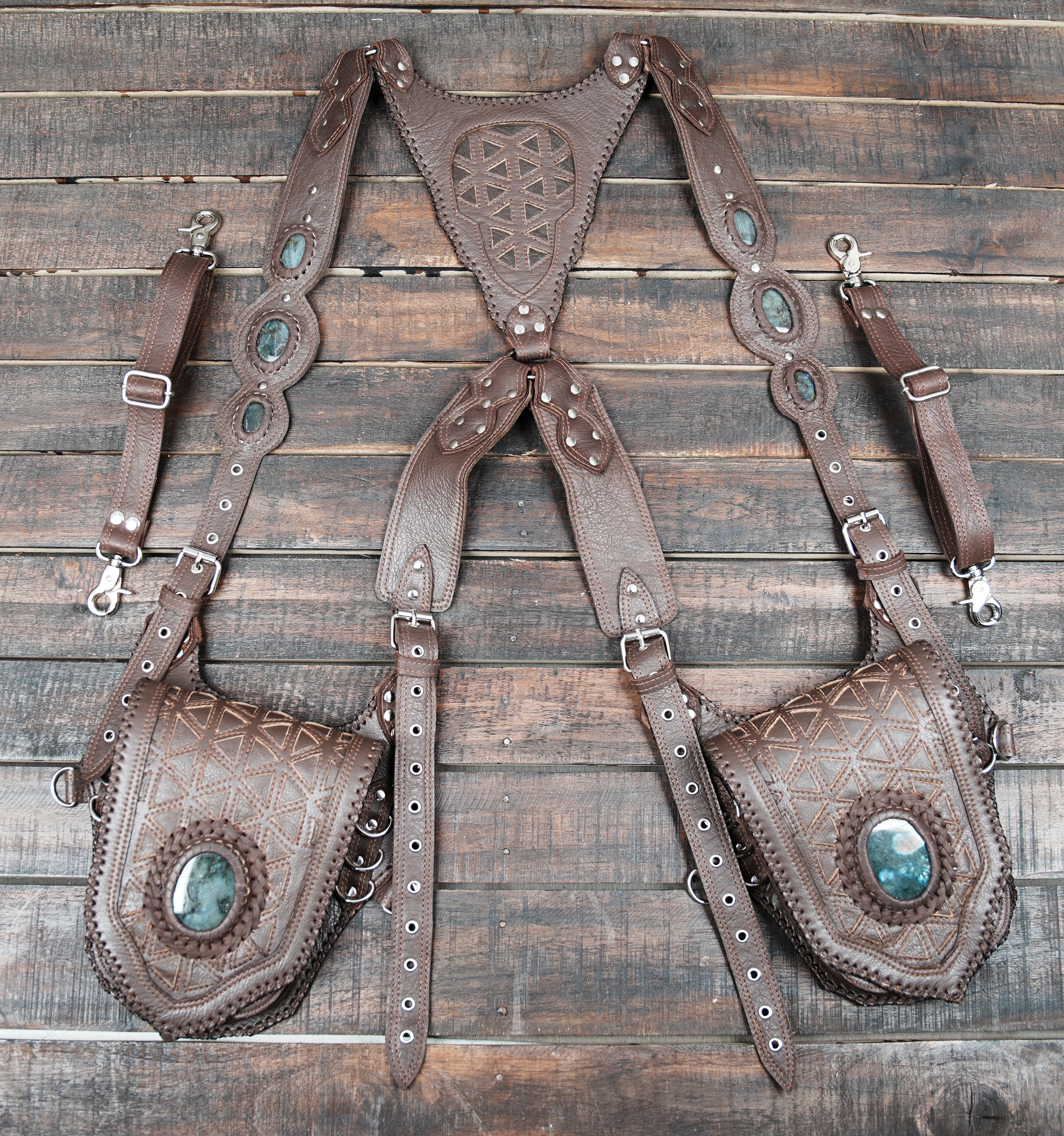 Decorative leather holster with adjustable fit and metal clasps