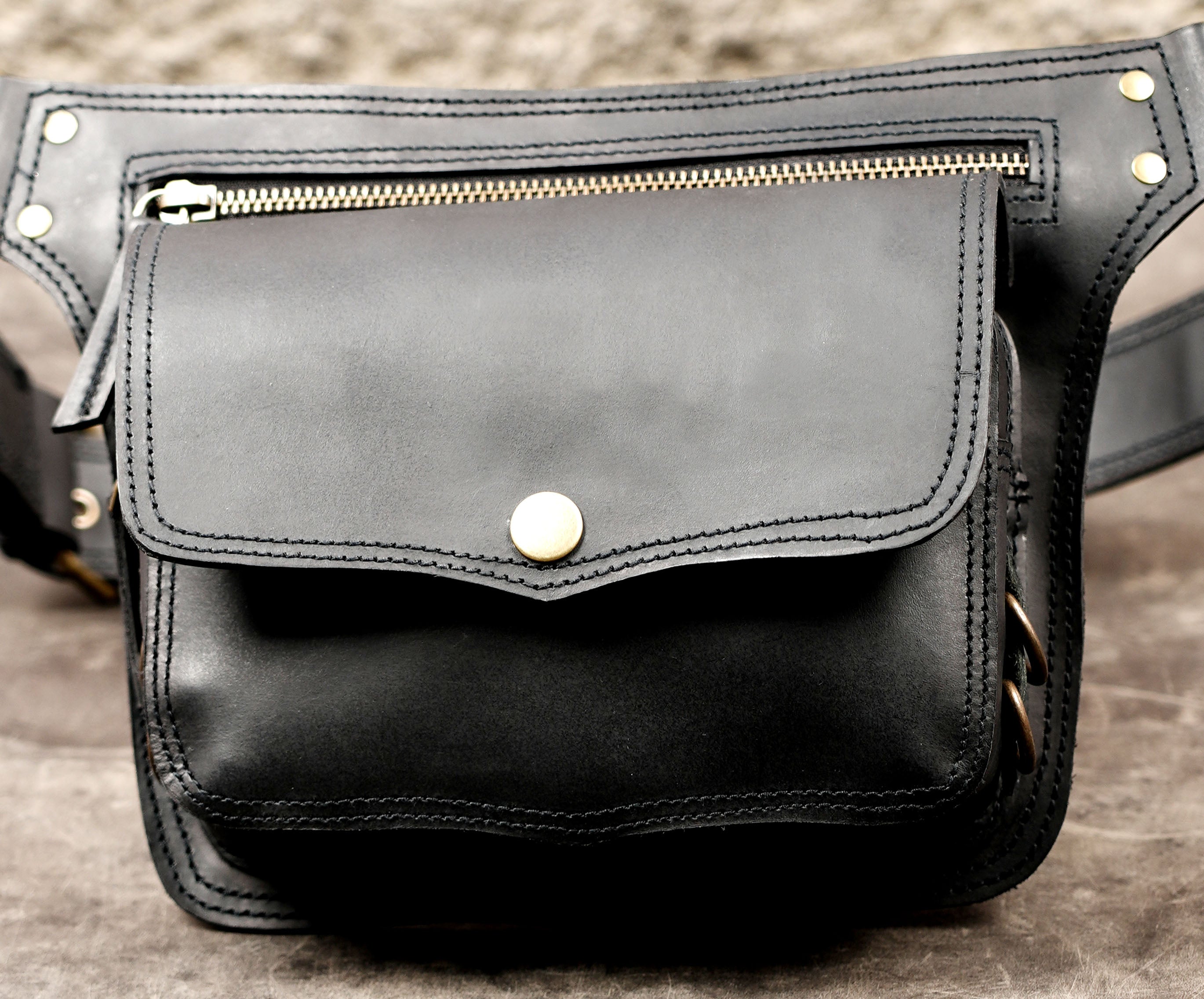 Black leather hip pouch with adjustable strap