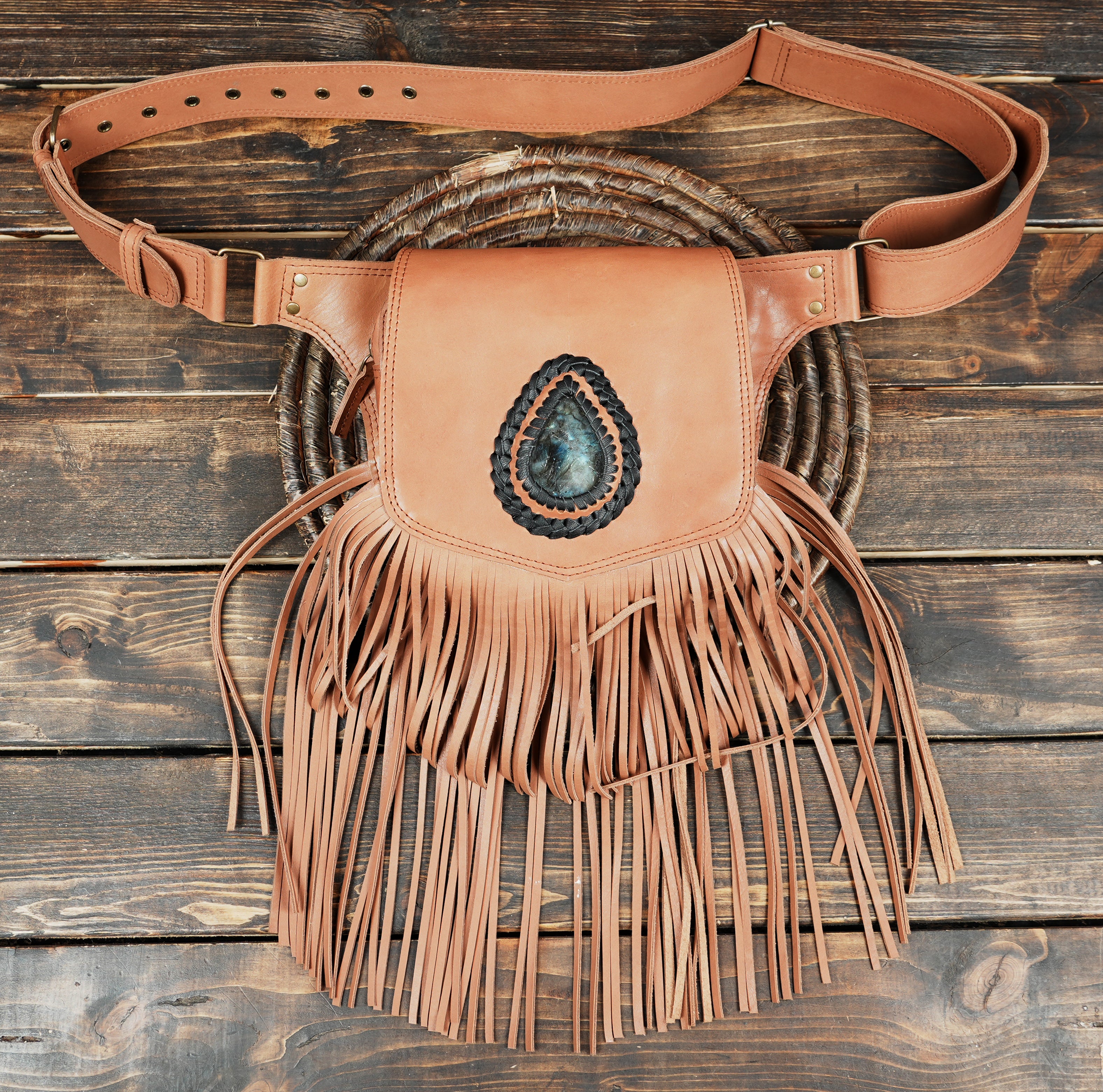 Stylish black leather festival pocket belt featuring dynamic fringe