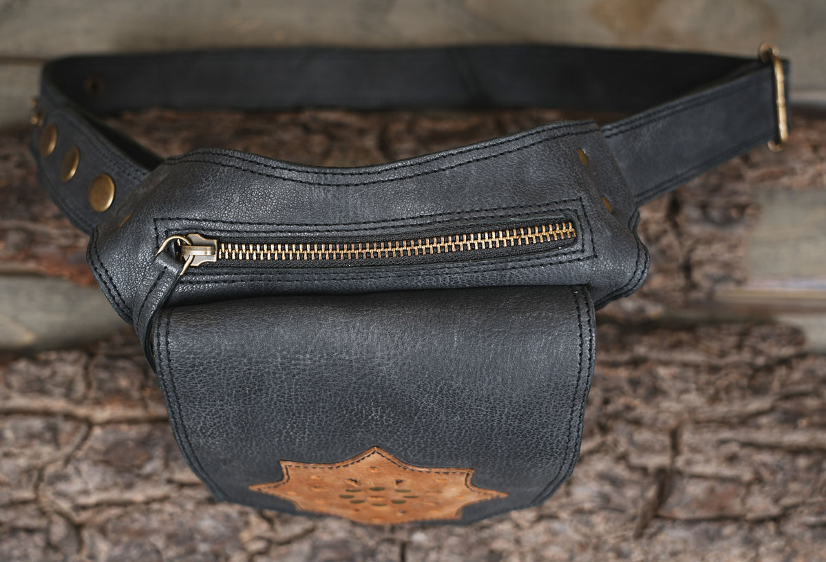 Handmade leather waist bag with brass stud details and front zipper