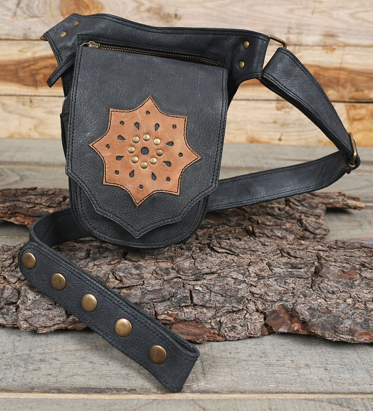 Textured black leather hip holster featuring tan leather centerpiece