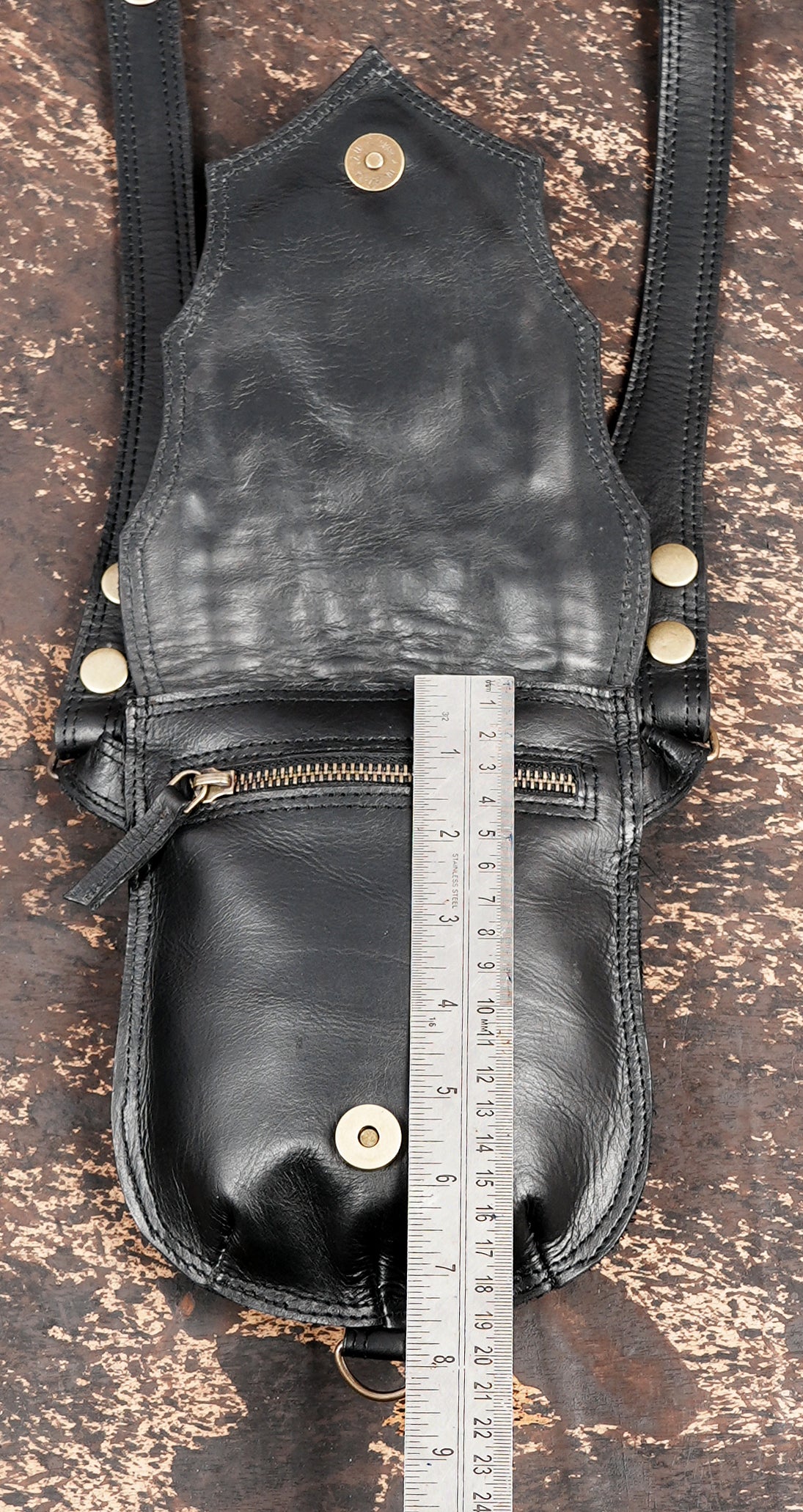 Adjustable black leather utility holster with twin pouch design